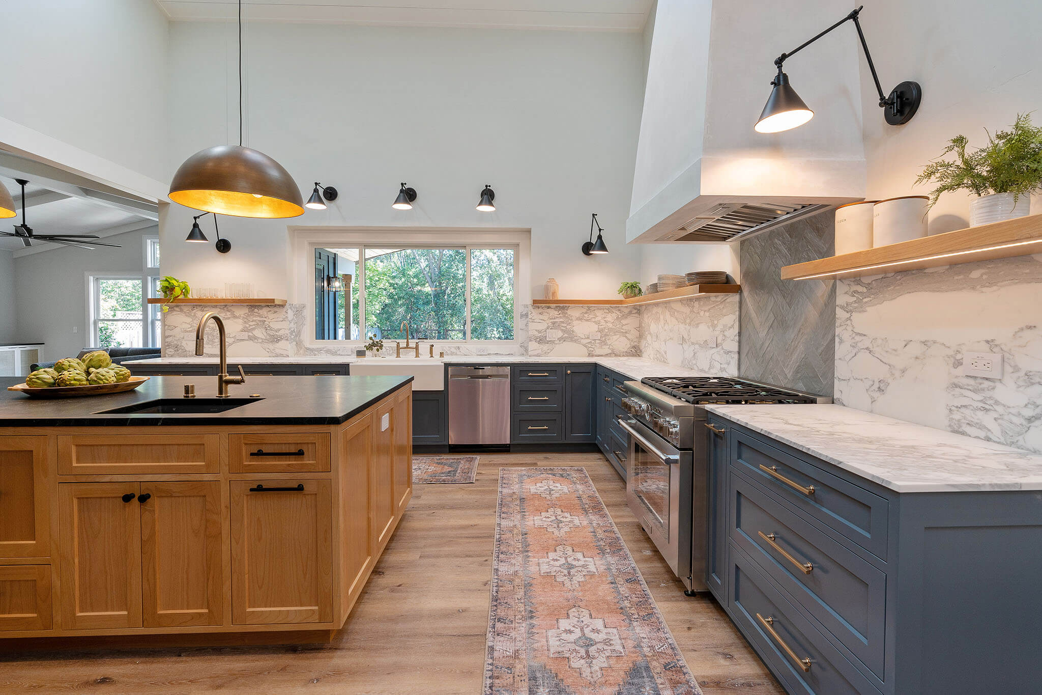 kitchen with soapstone island and calacatta white marble perimeter countertops